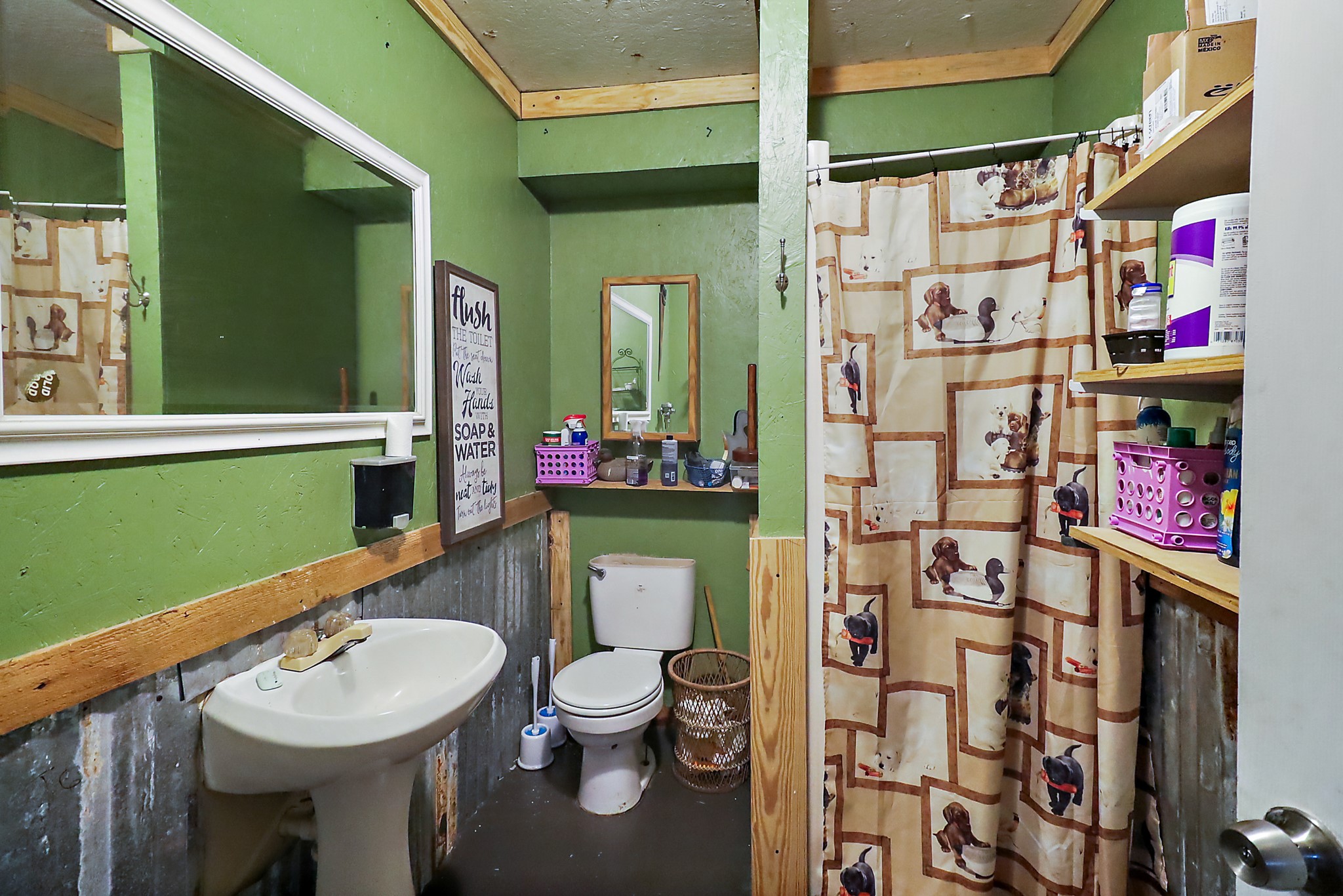 13659 Todd Road Winnie, TX 77665 - Photo 27 of 42 a bathroom with a sink toilet and a shower