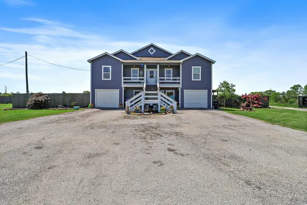 a view of a house with a big yard
