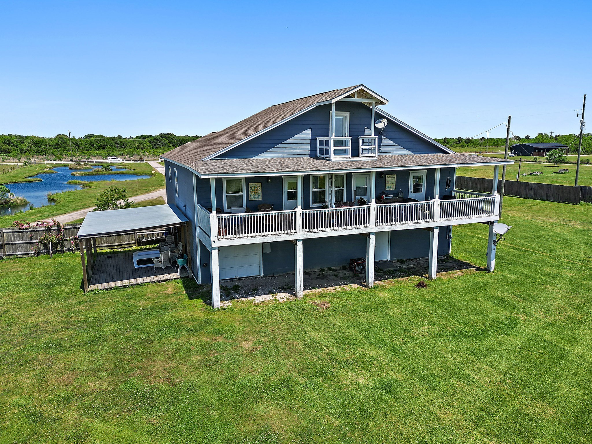 13659 Todd Road Winnie, TX 77665 - Photo 37 of 42 a view of a house with a big yard