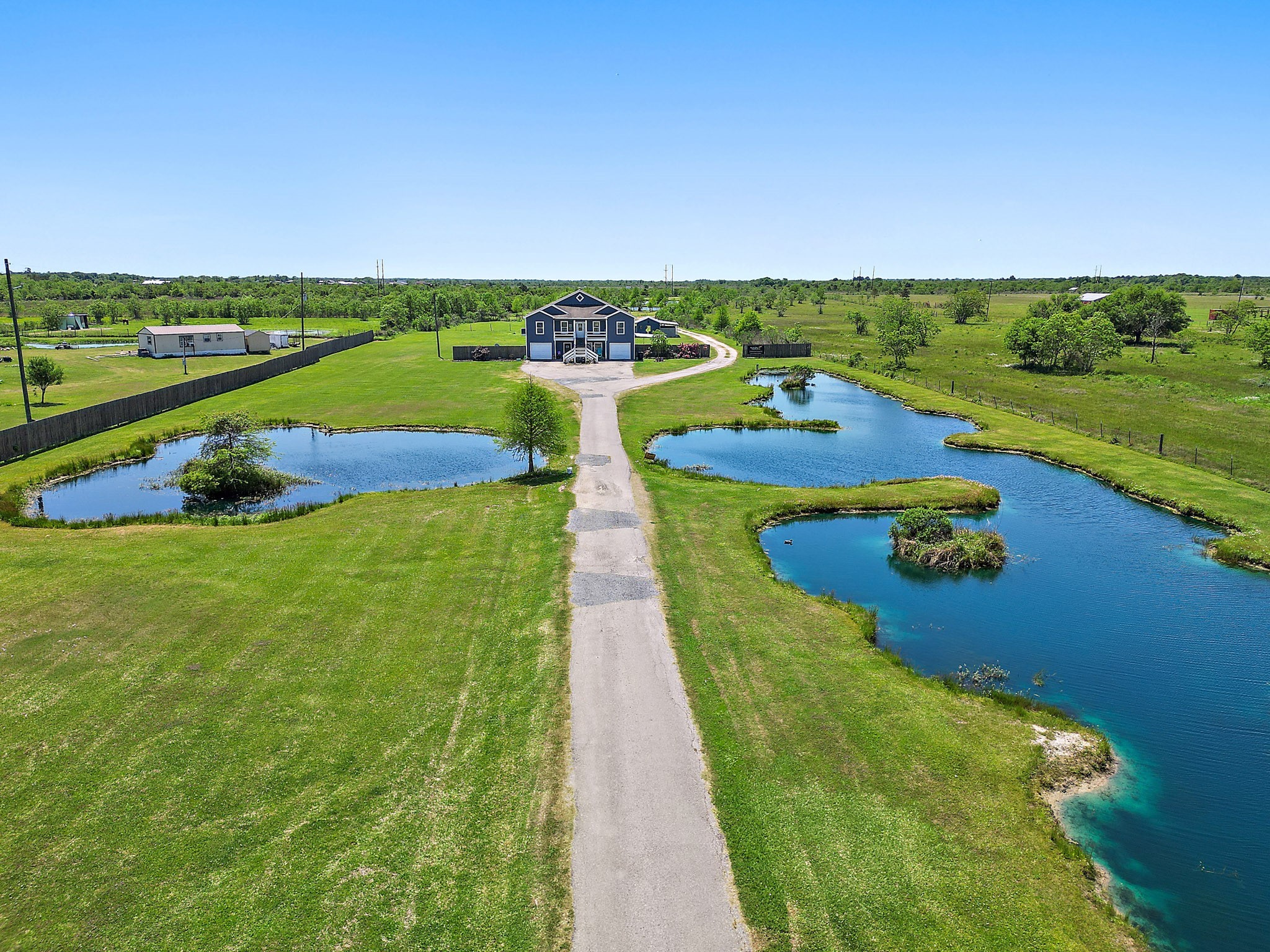 13659 Todd Road Winnie, TX 77665 - Photo 40 of 42 an aerial view of a house with a yard
