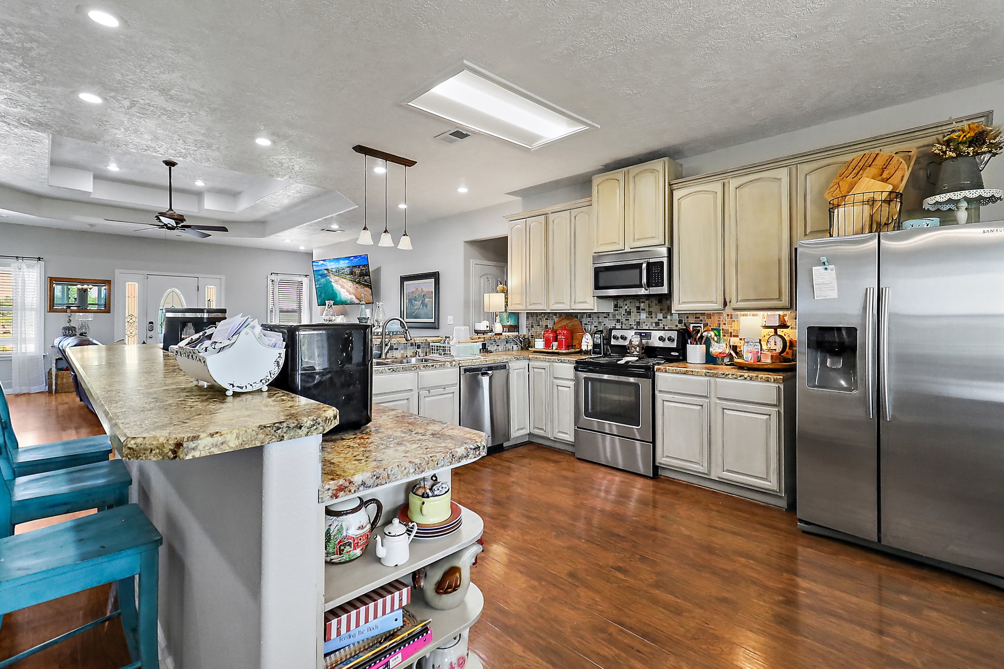 13659 Todd Road Winnie, TX 77665 - Photo 8 of 42 a kitchen with stainless steel appliances granite countertop a refrigerator stove microwave and sink