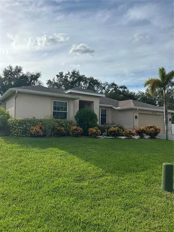 a house view with a garden space