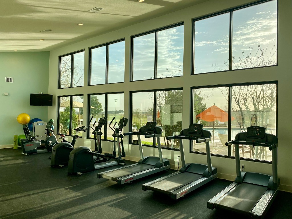 8317 Daisy Cutter Crossing Georgetown, TX 78626 - Photo 11 of 17 a view of a room with gym equipment