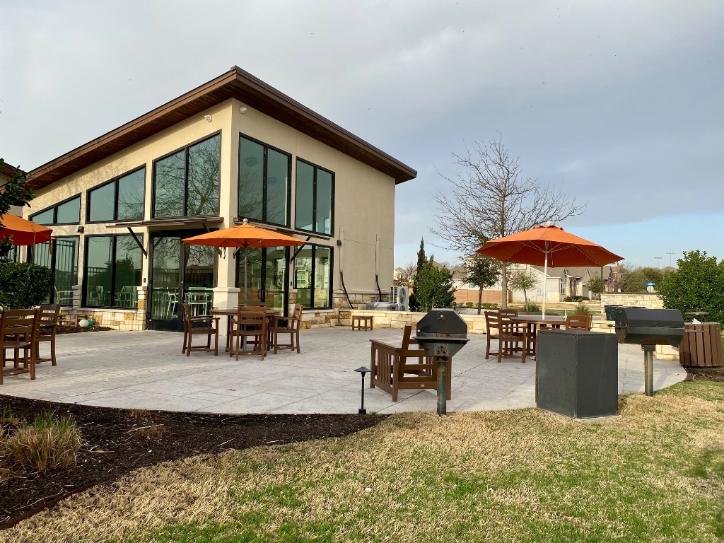 8317 Daisy Cutter Crossing Georgetown, TX 78626 - Photo 12 of 17 a view of a house with backyard porch and sitting area