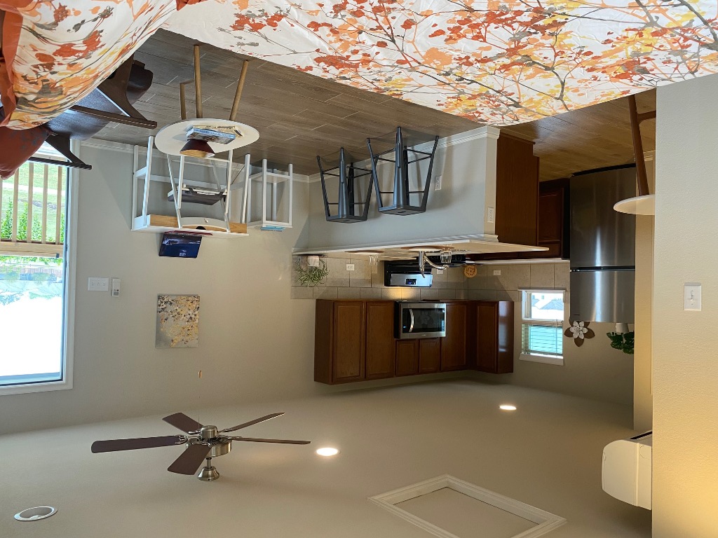 8317 Daisy Cutter Crossing Georgetown, TX 78626 - Photo 2 of 17 a kitchen with a refrigerator and a stove top oven