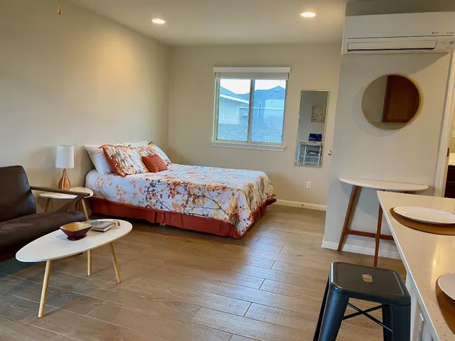 a bedroom with a bed and a chair