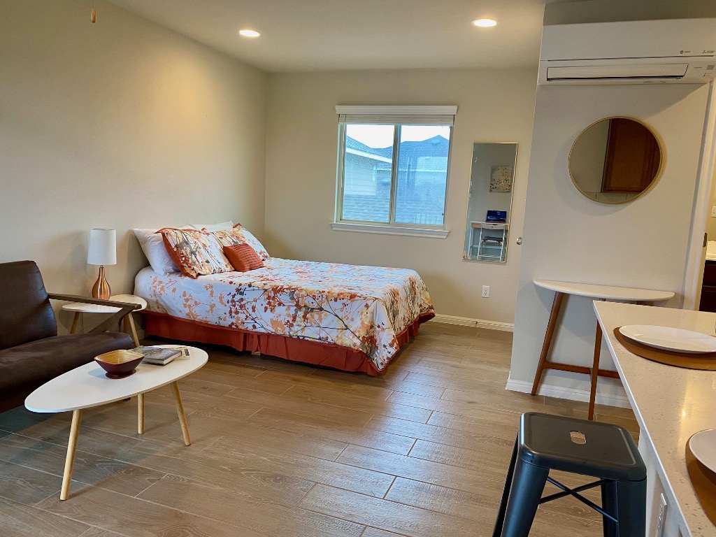 8317 Daisy Cutter Crossing Georgetown, TX 78626 - Photo 3 of 17 a bedroom with a bed and a chair