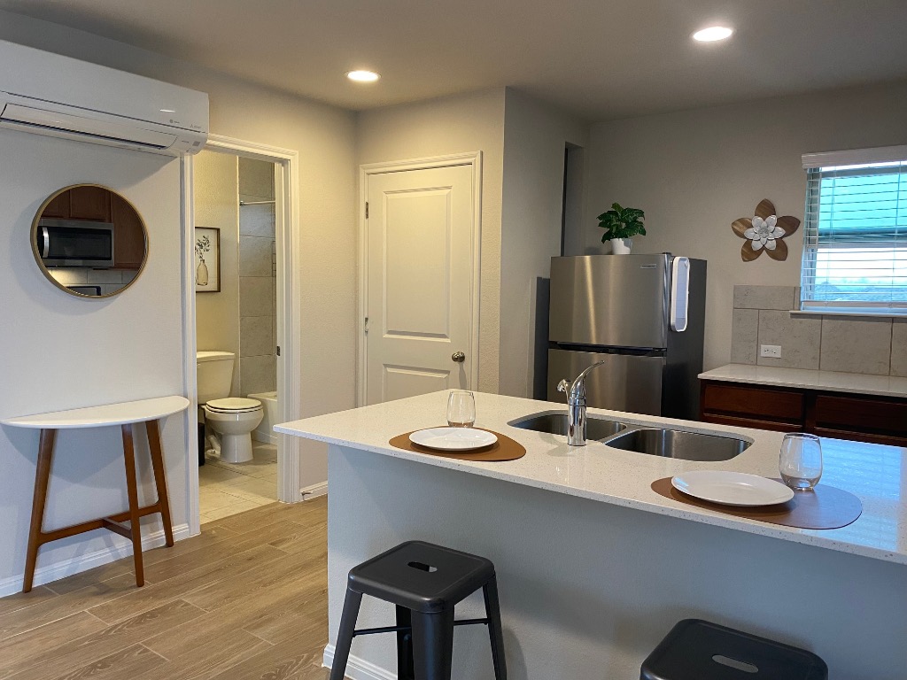 8317 Daisy Cutter Crossing Georgetown, TX 78626 - Photo 4 of 17 a bathroom with a sink a toilet and a mirror