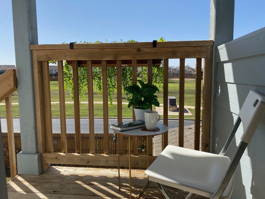 8317 Daisy Cutter Crossing Georgetown, TX 78626 - Photo 7 of 17 a view of a balcony with an outdoor seating