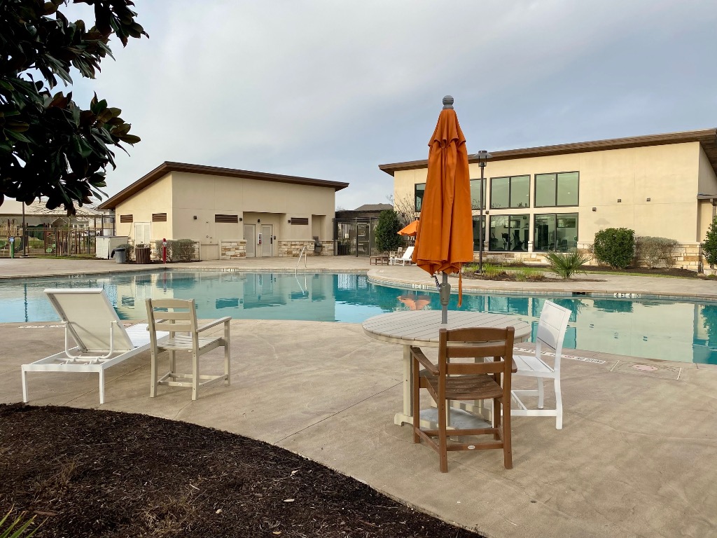 8317 Daisy Cutter Crossing Georgetown, TX 78626 - Photo 10 of 17 a view of a patio with table and chairs and potted plants