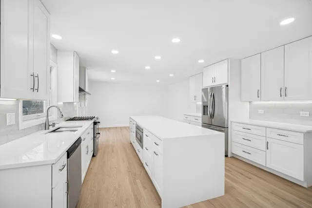 a view of a balcony with wooden floor and fence
