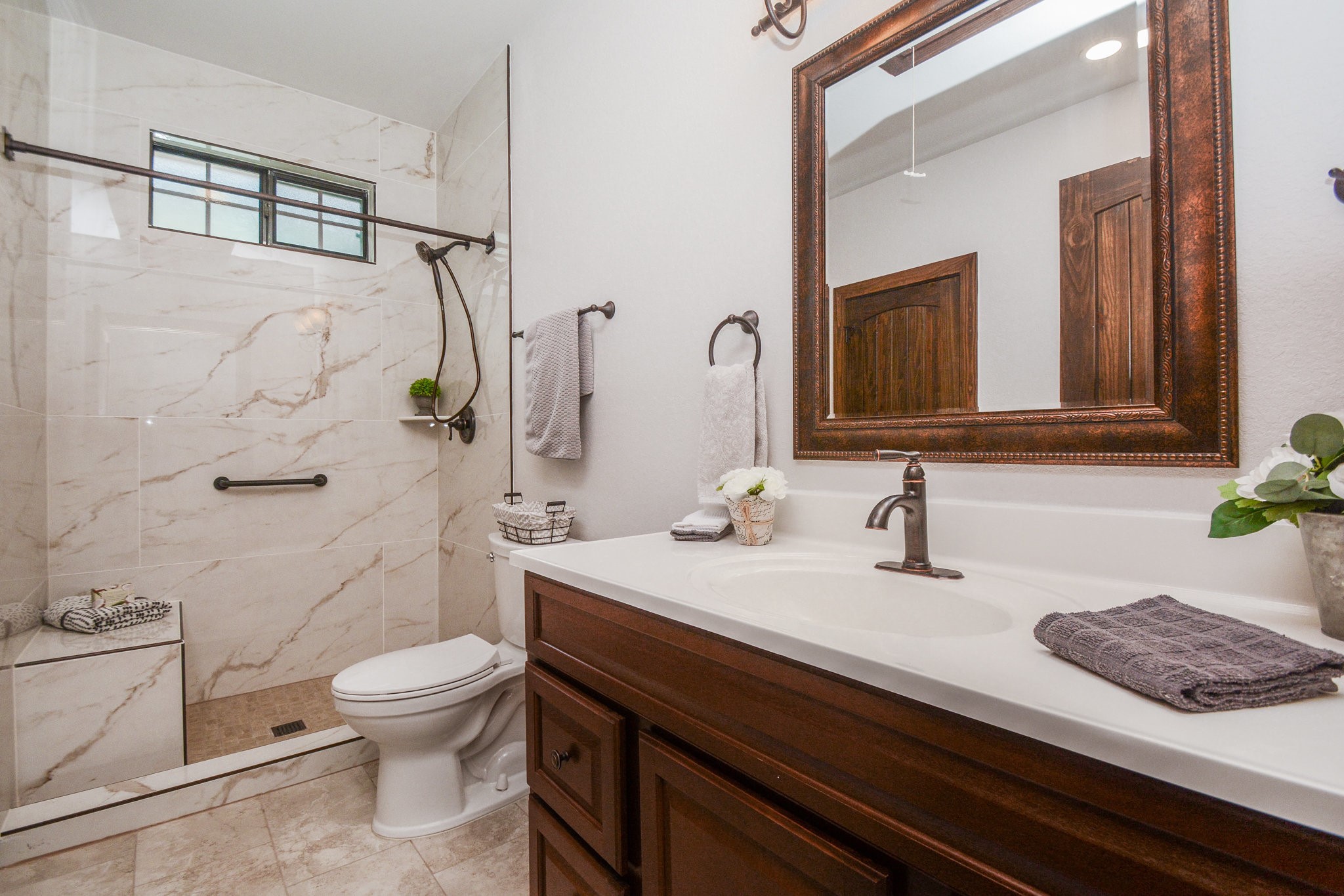 29529 B Turnbury Village Drive Spring, TX 77386 - Photo 15 of 32 a bathroom with a granite countertop sink a toilet and a mirror