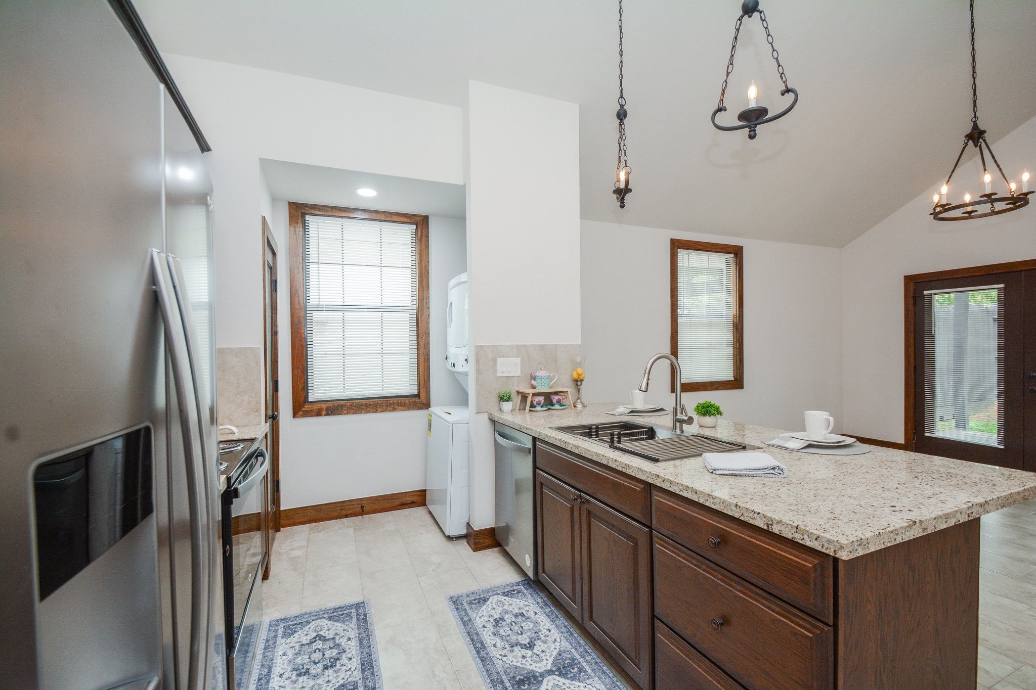 29529 B Turnbury Village Drive Spring, TX 77386 - Photo 24 of 32 a kitchen with stainless steel appliances granite countertop a sink stove and refrigerator