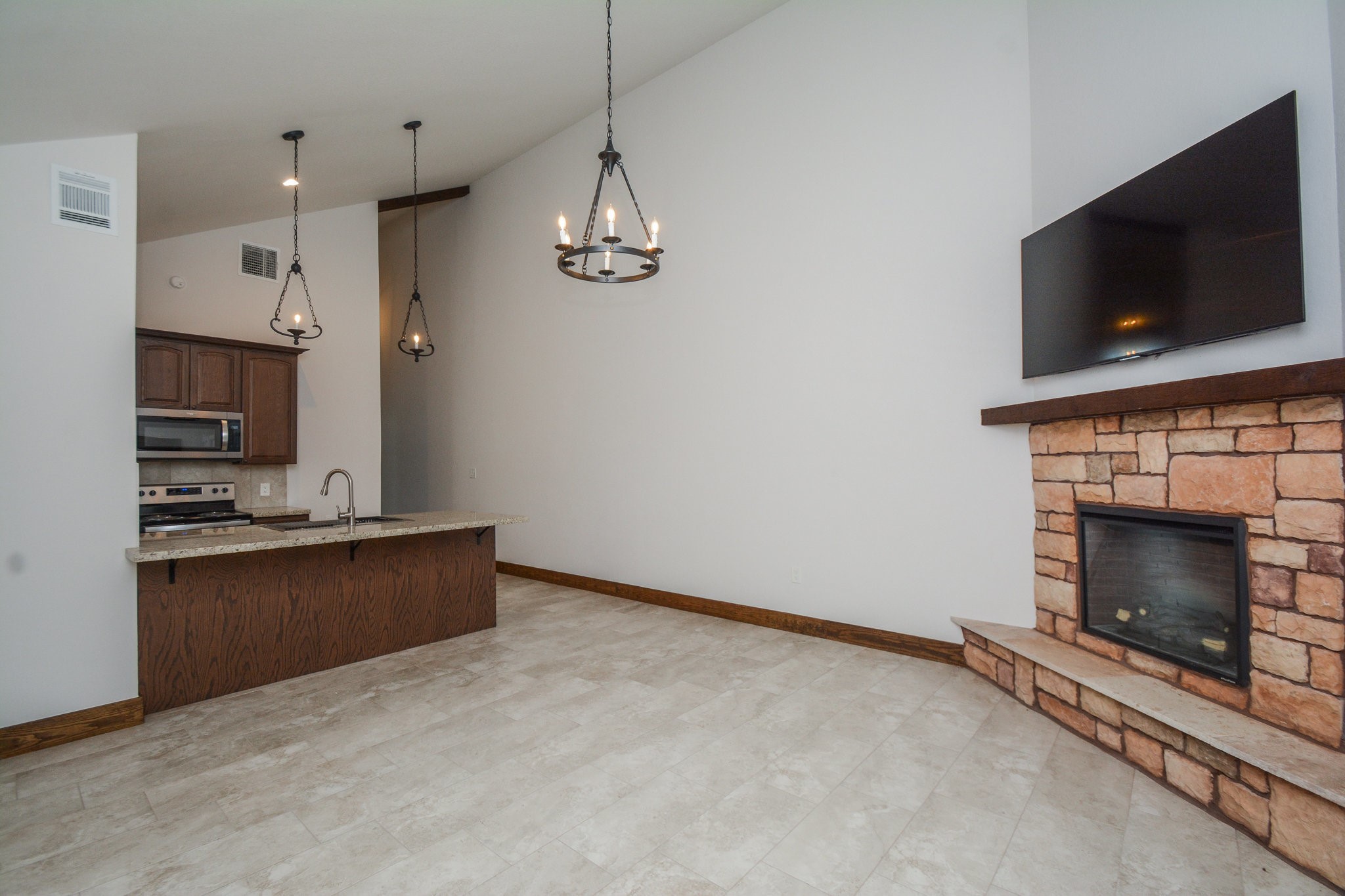 29529 B Turnbury Village Drive Spring, TX 77386 - Photo 31 of 32 a view of kitchen and fireplace with empty space