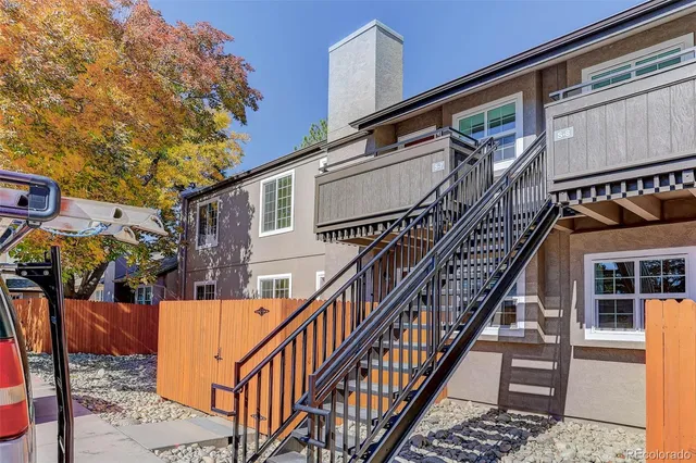 a view of a house with wooden stairs
