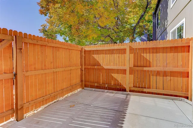 a view of staircase with railing and a window