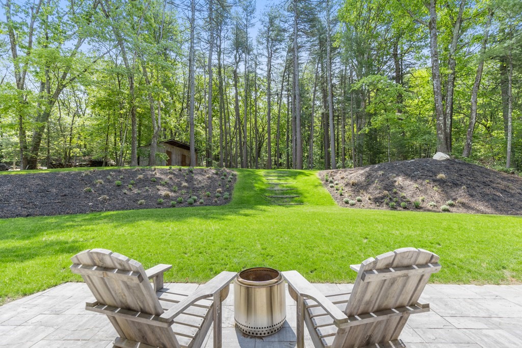 63 Moore Road Wayland, MA 01778 - Photo 29 of 36 a view of a table and chairs in the garden