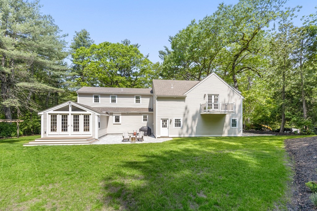 63 Moore Road Wayland, MA 01778 - Photo 34 of 36 front view of a house with a yard