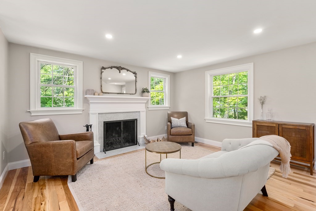 63 Moore Road Wayland, MA 01778 - Photo 4 of 36 a living room with furniture and a fireplace