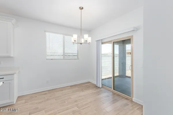 a view of a chandelier in a room and window