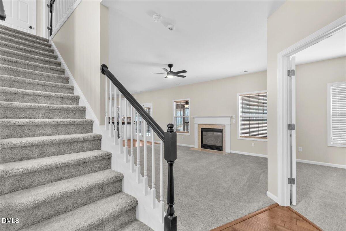 708 Straywhite Avenue Apex, NC 27539 - Photo 12 of 69 a view of a livingroom with an empty room and fireplace