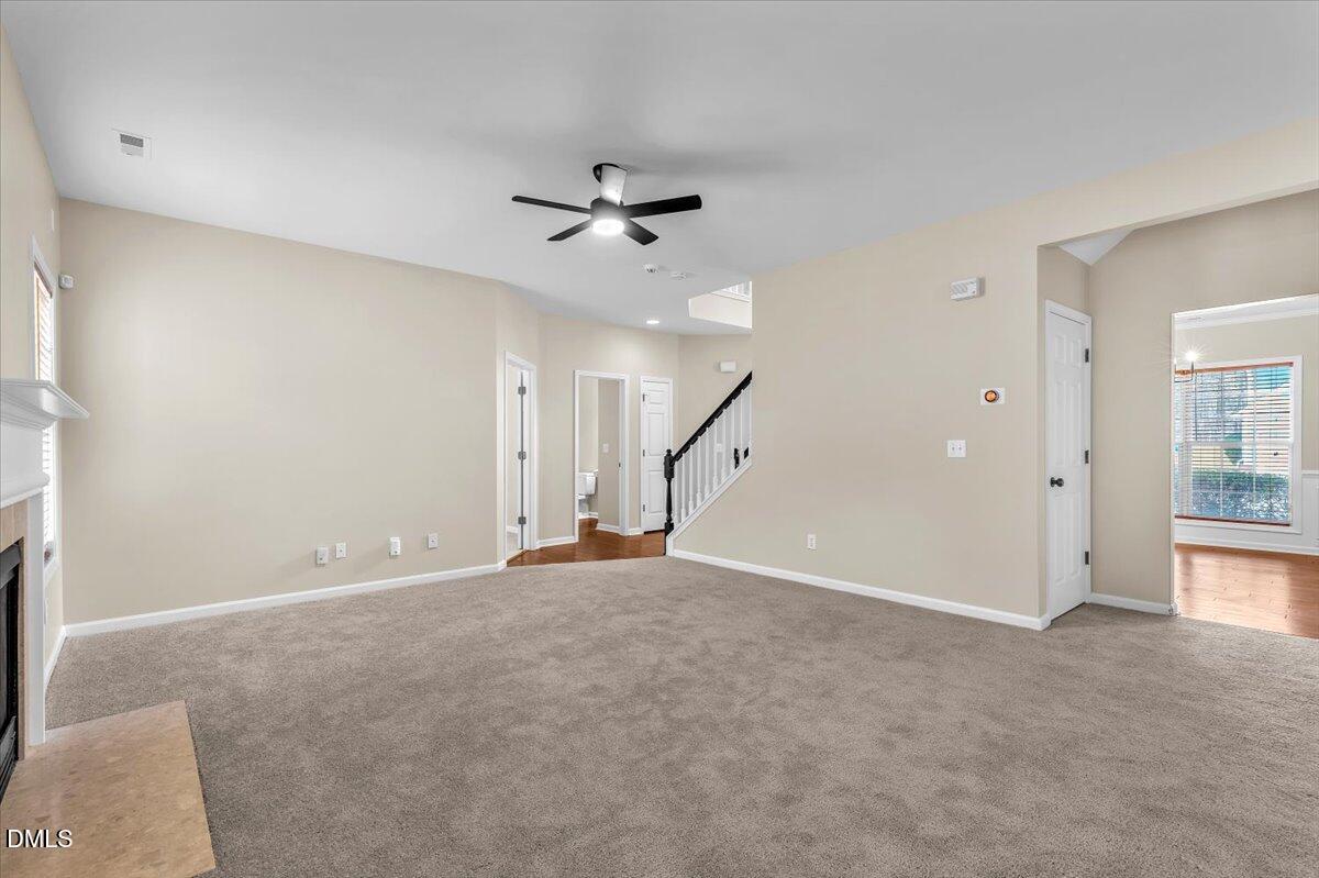 708 Straywhite Avenue Apex, NC 27539 - Photo 16 of 69 a view of an empty room with a fireplace