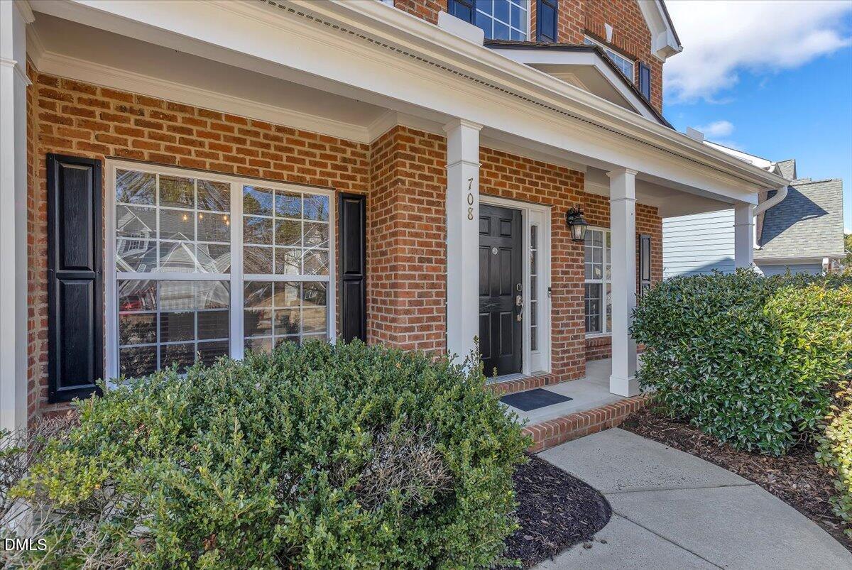 708 Straywhite Avenue Apex, NC 27539 - Photo 2 of 69 front view of a brick house with a large windows