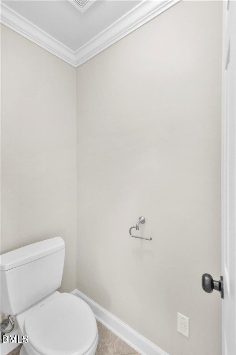 708 Straywhite Avenue Apex, NC 27539 - Photo 41 of 69 a white toilet sitting next to a shower