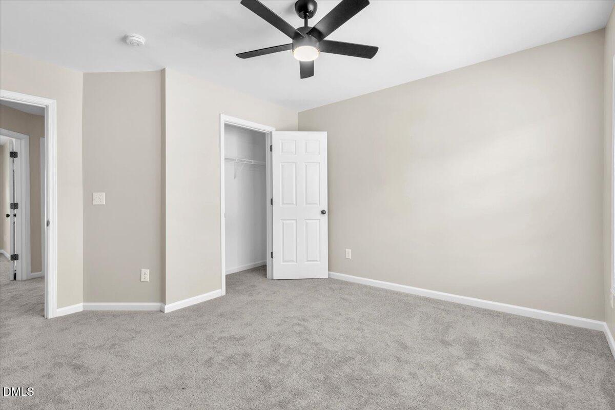 708 Straywhite Avenue Apex, NC 27539 - Photo 46 of 69 an empty room with closet and windows