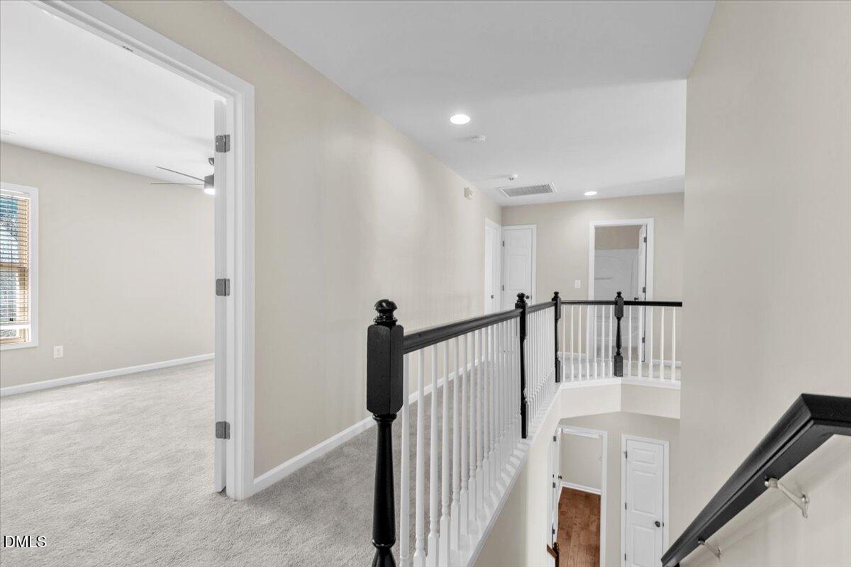 708 Straywhite Avenue Apex, NC 27539 - Photo 47 of 69 a view of a hallway with staircase