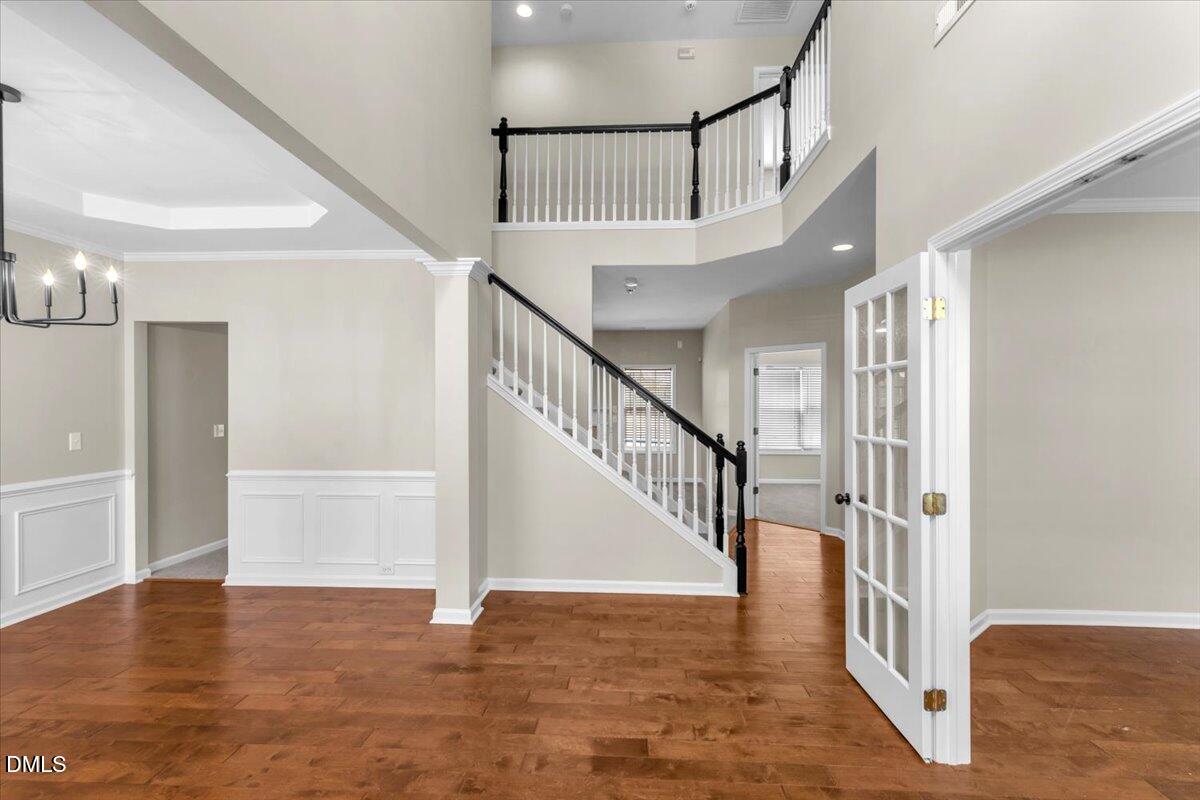 708 Straywhite Avenue Apex, NC 27539 - Photo 6 of 69 a view of staircase with white walls and a window