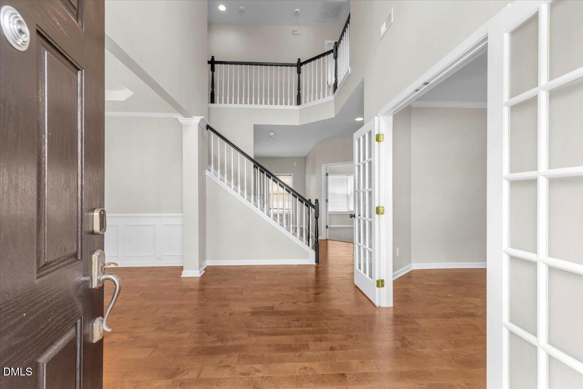 708 Straywhite Avenue Apex, NC 27539 - Photo 7 of 69 a view of entryway and hall with wooden floor