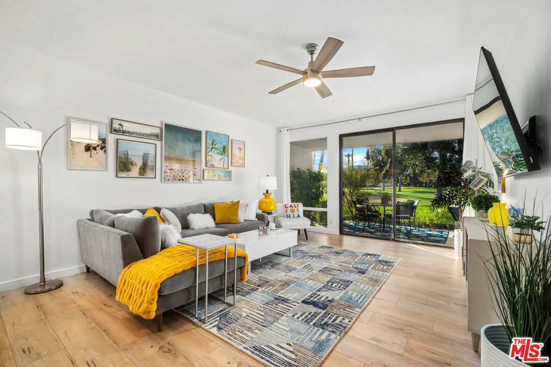 60 La Ronda Drive Rancho Mirage, CA 92270 - Photo 2 of 57 a living room with furniture and a flat screen tv