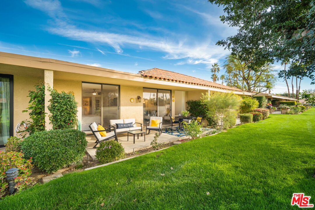 60 La Ronda Drive Rancho Mirage, CA 92270 - Photo 46 of 57 a view of a house with backyard sitting area and garden
