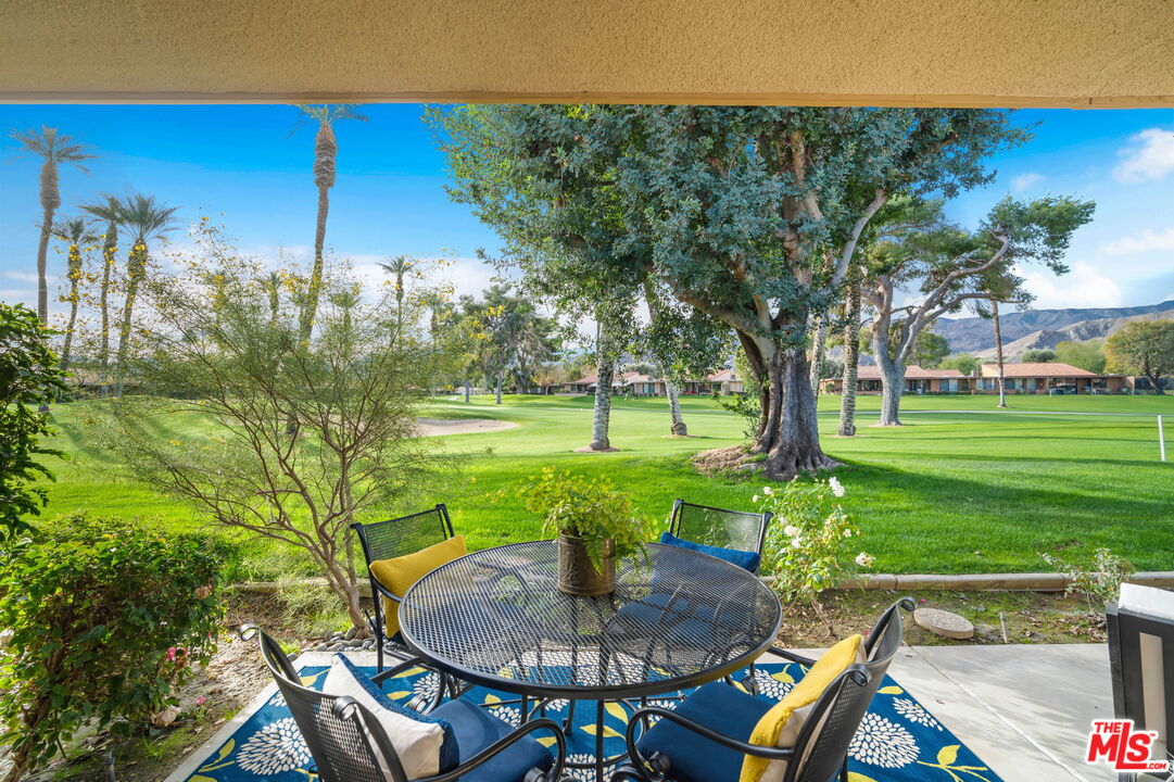 60 La Ronda Drive Rancho Mirage, CA 92270 - Photo 5 of 57 a backyard of a house with outdoor seating
