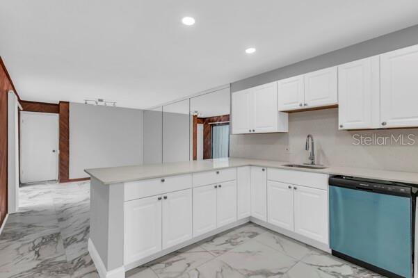 1502 Lake Buckeye Road, Unit 2 Winter Haven, FL 33881 - Photo 12 of 47 a kitchen with white cabinets