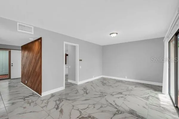 a bathroom with a sink and a large mirror