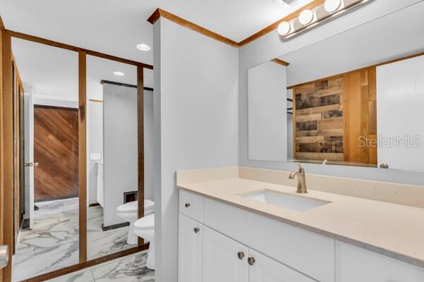 1502 Lake Buckeye Road, Unit 2 Winter Haven, FL 33881 - Photo 19 of 47 a bathroom with a sink and a large mirror