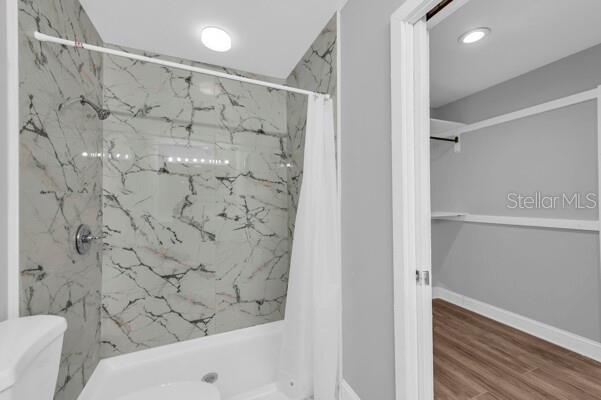 1502 Lake Buckeye Road, Unit 2 Winter Haven, FL 33881 - Photo 23 of 47 a bathroom with a bathtub and shower