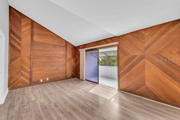 1502 Lake Buckeye Road, Unit 2 Winter Haven, FL 33881 - Photo 26 of 47 a view of an empty room with wooden floor and a window