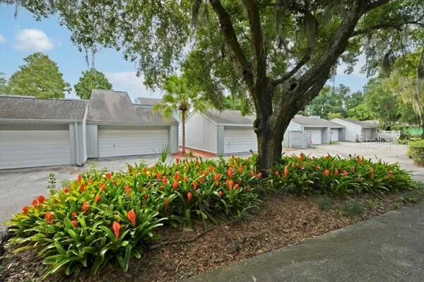 a front view of a house with a yard and a garage