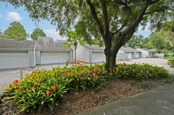 1502 Lake Buckeye Road, Unit 2 Winter Haven, FL 33881 - Photo 34 of 47 a front view of a house with garden