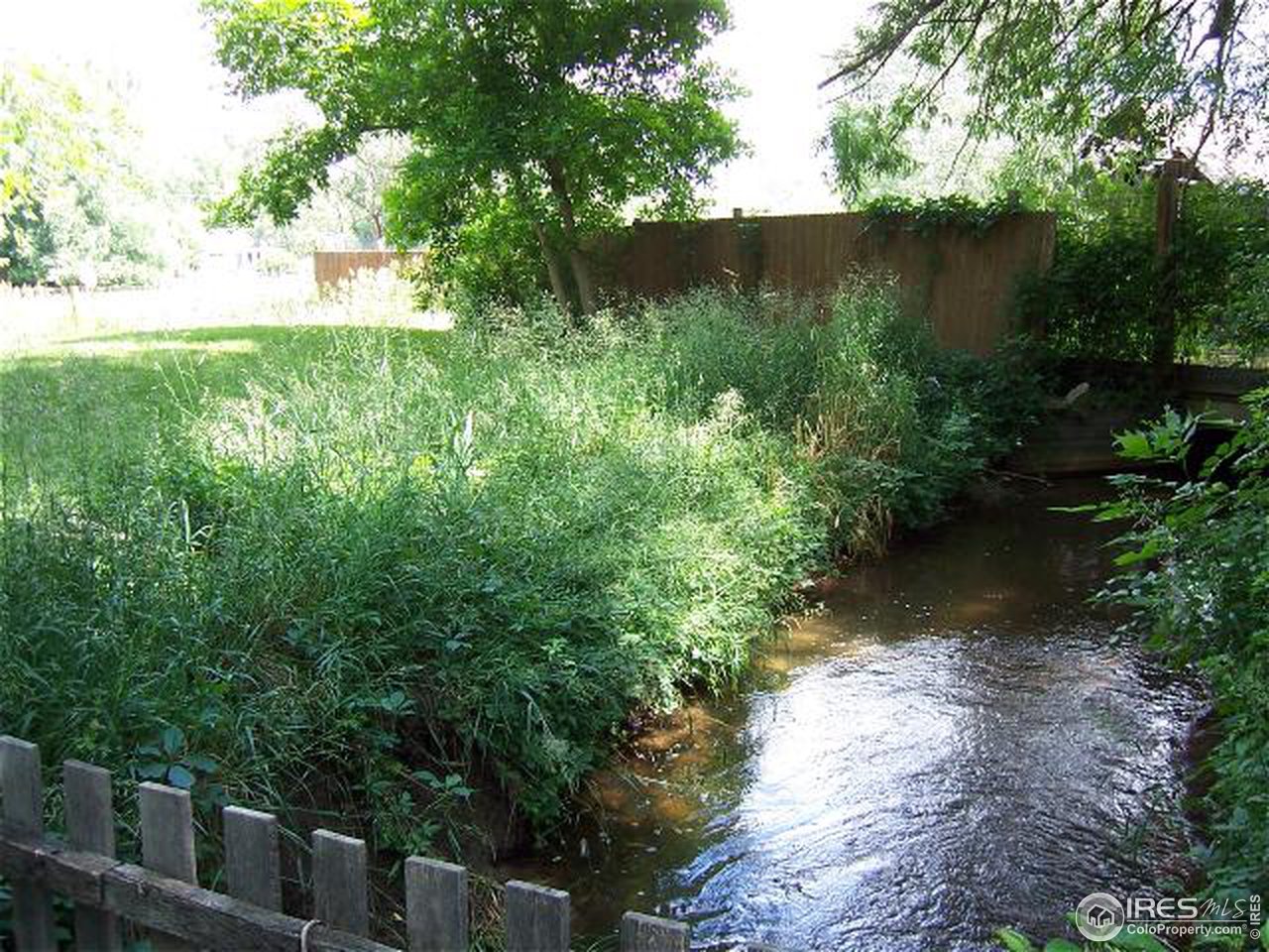 6025 Valmont Road Boulder, CO 80301 - Photo 3 of 6 a view of a garden with a lake