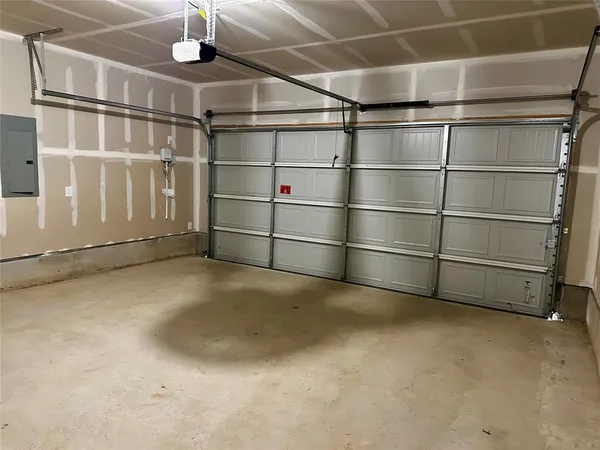 a view of an empty room with racks on the wall