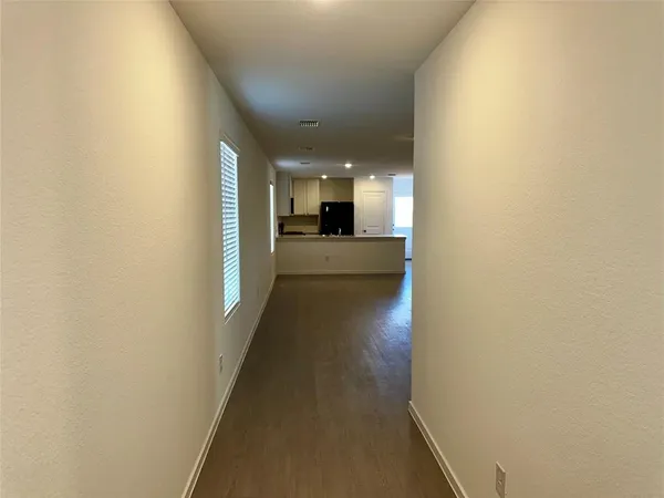 a view of a hallway from a hallway