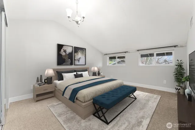 a bedroom with a large bed and a window