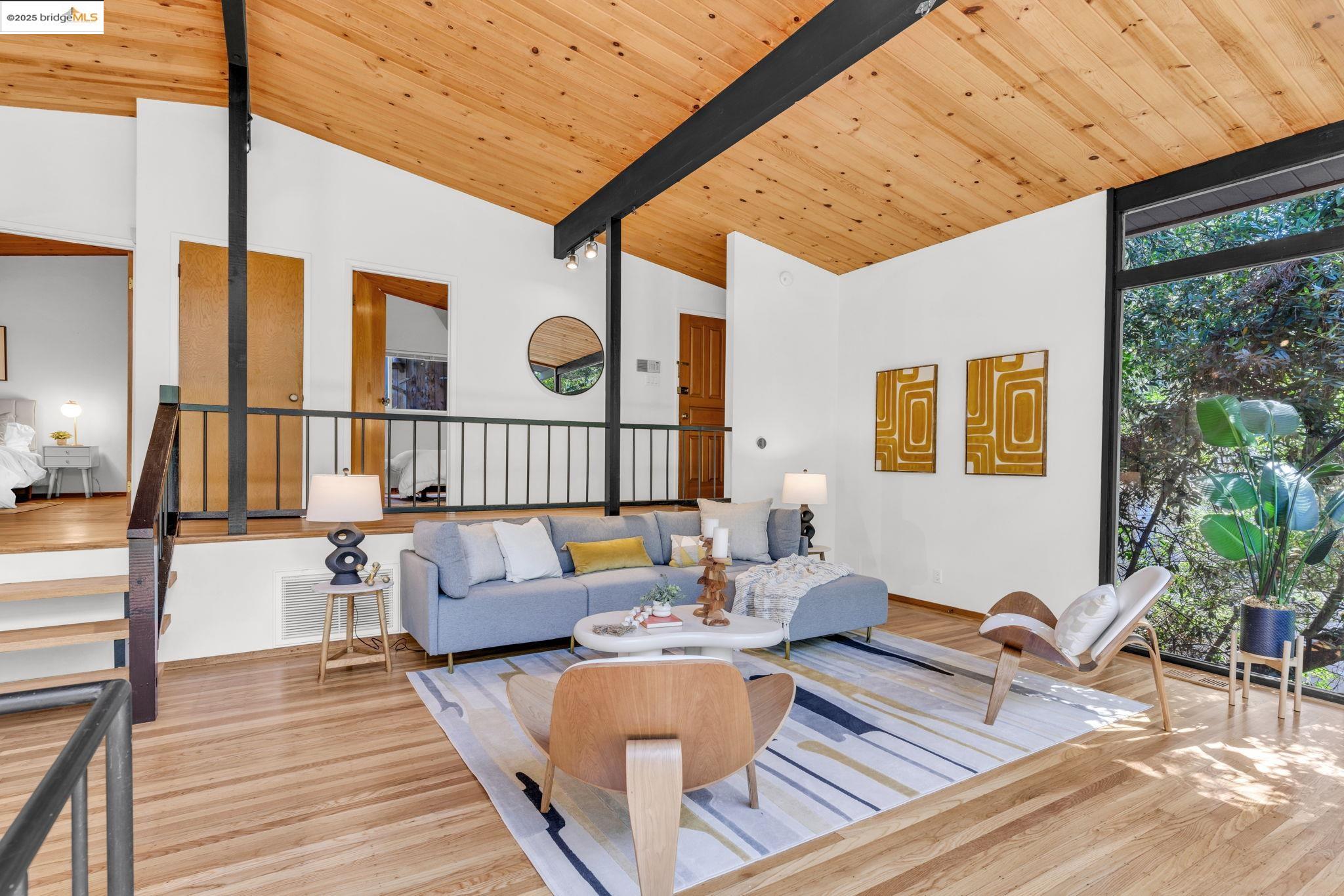 2211 Arrowhead Drive Oakland, CA 94611 - Photo 14 of 52 Living room featuring wood finished floors, a wooden ceiling with exposed beams, high vaulted ceiling, and stairway