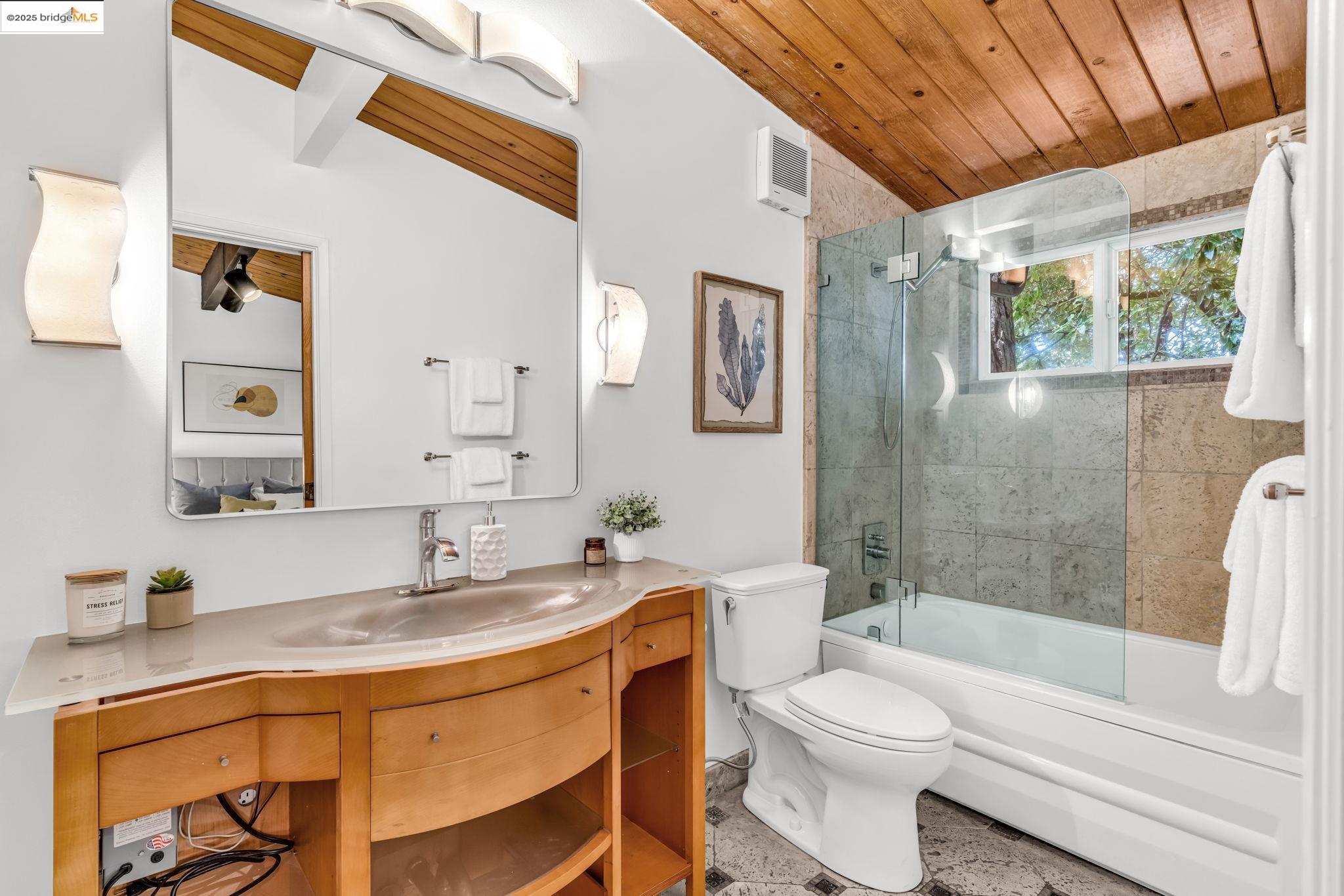 2211 Arrowhead Drive Oakland, CA 94611 - Photo 31 of 52 Bathroom with combined bath / shower with glass door, vanity, and wood ceiling