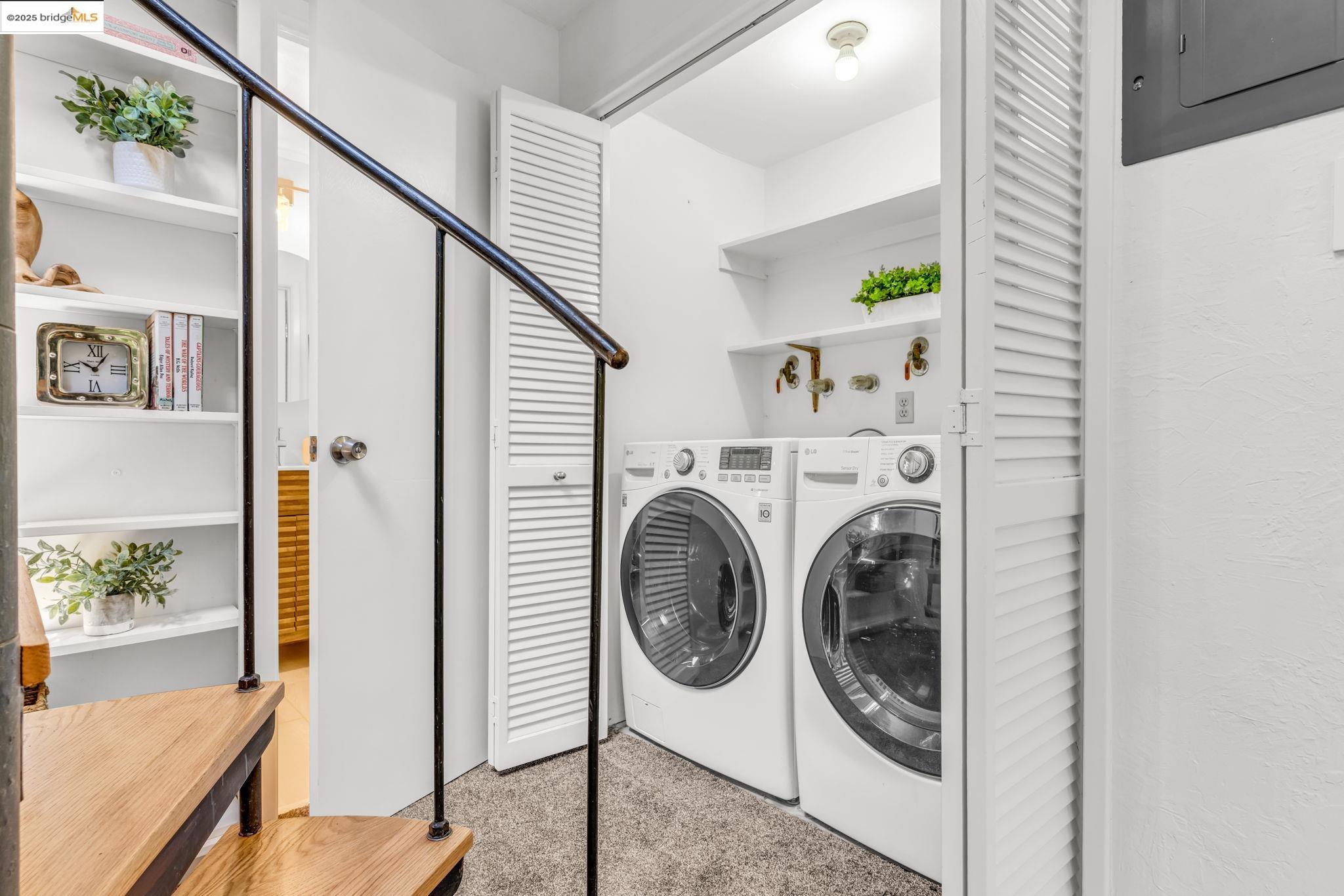 2211 Arrowhead Drive Oakland, CA 94611 - Photo 40 of 52 Laundry area featuring washing machine and clothes dryer, electric panel, and carpet flooring