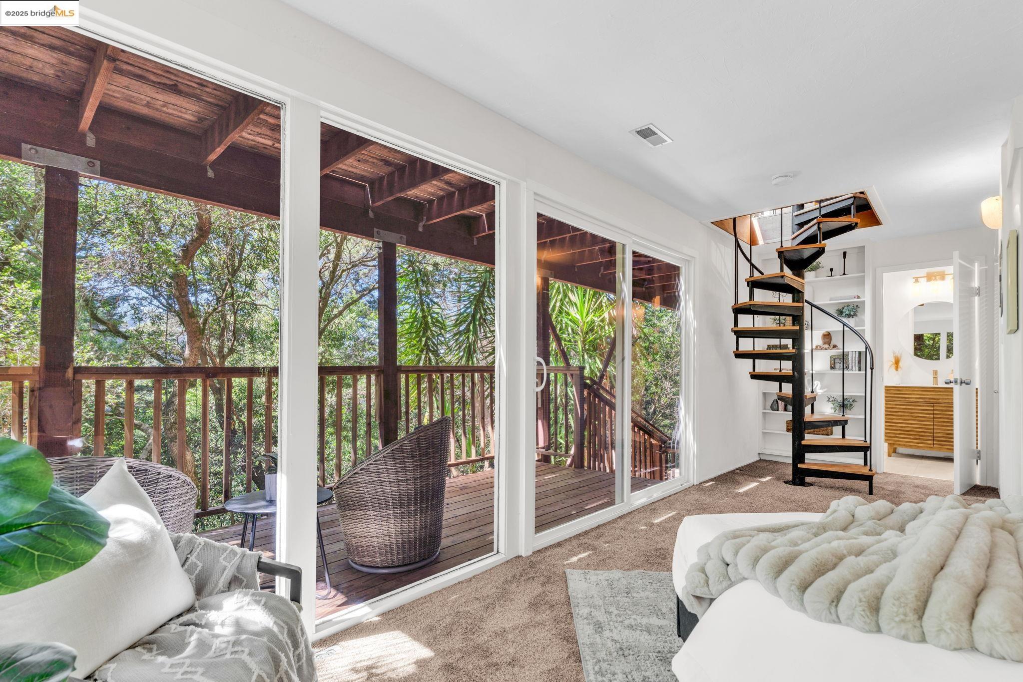 2211 Arrowhead Drive Oakland, CA 94611 - Photo 41 of 52 Doorway with carpet floors and stairs